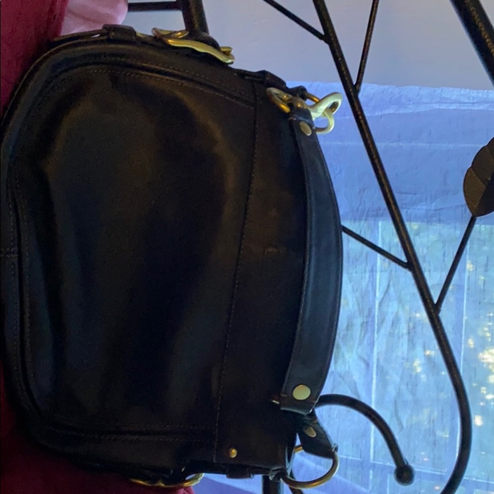 All leather brown gently used coach bag .